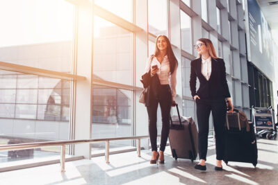 Business Travelers Walking Phones