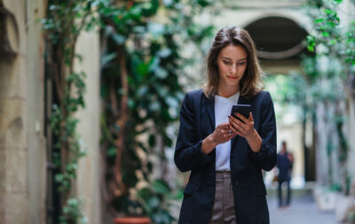 Businesswoman Checking In On Phone