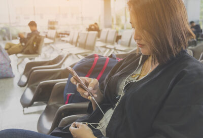 Student Passenger Using Phone to Check In