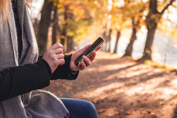 Woman Using Smartphone Check-In