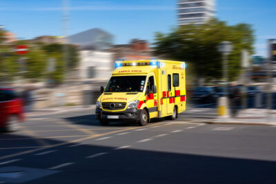 Ambulance rushes to an injured person overseas.