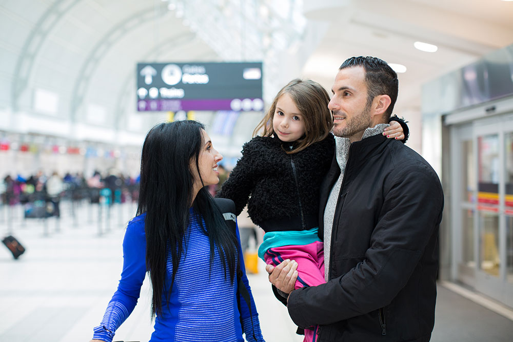 Family Traveling Airport During Holiday Travel