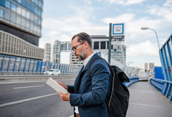 Business Traveler Navigating an Unfamiliar City Between Meetings