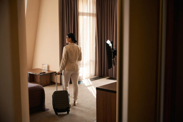 Business Traveler Remaining Safely Inside a Hotel During Civil Unrest