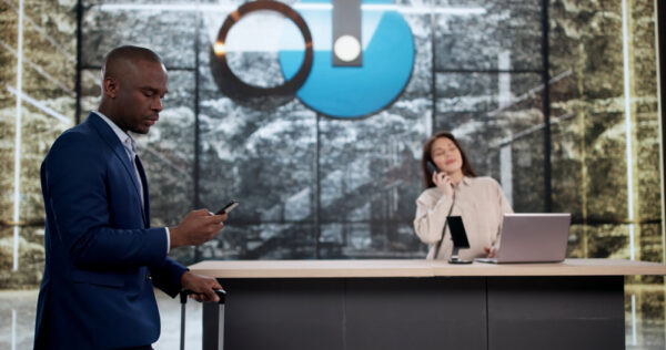 Corporate Traveler Checking in with a Security Team Using a Mobile Travel Safety Application
