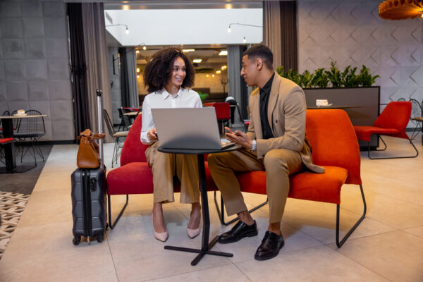 Small business leaders reviewing employee travel risks and international travel safety plans.
