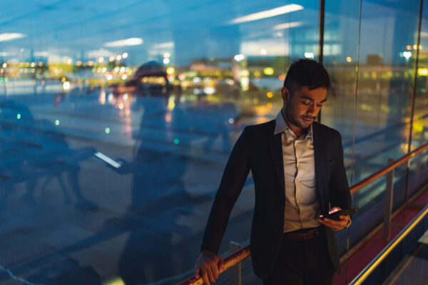 Executive reviewing international travel security information before a business trip.