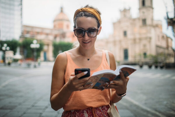 Study abroad student using traveler safety technology.