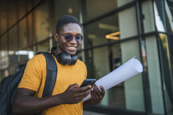 Study abroad student using a travel safety app to Check-In with their university abroad.